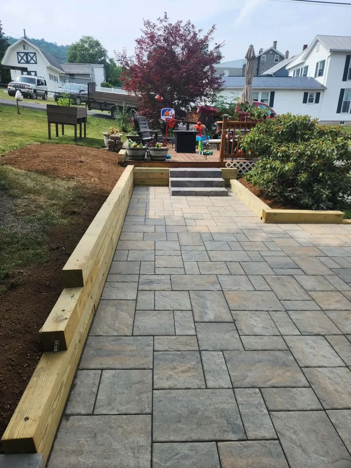 Custom patio and retaining wall by KDI Hardscapes in Ashland PA