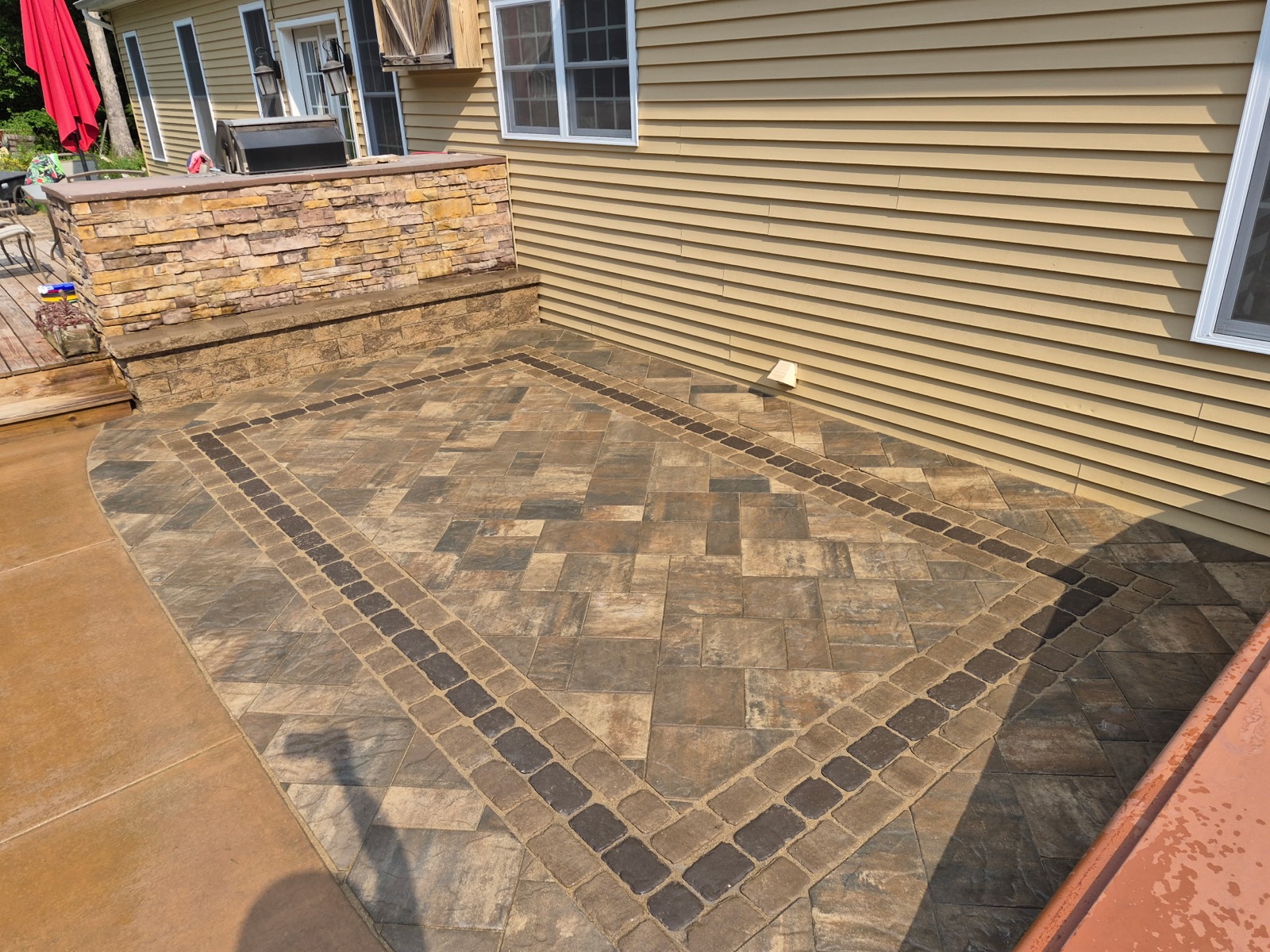 Paver patio and stone border installation in Schuylkill County PA by KDI Hardscapes